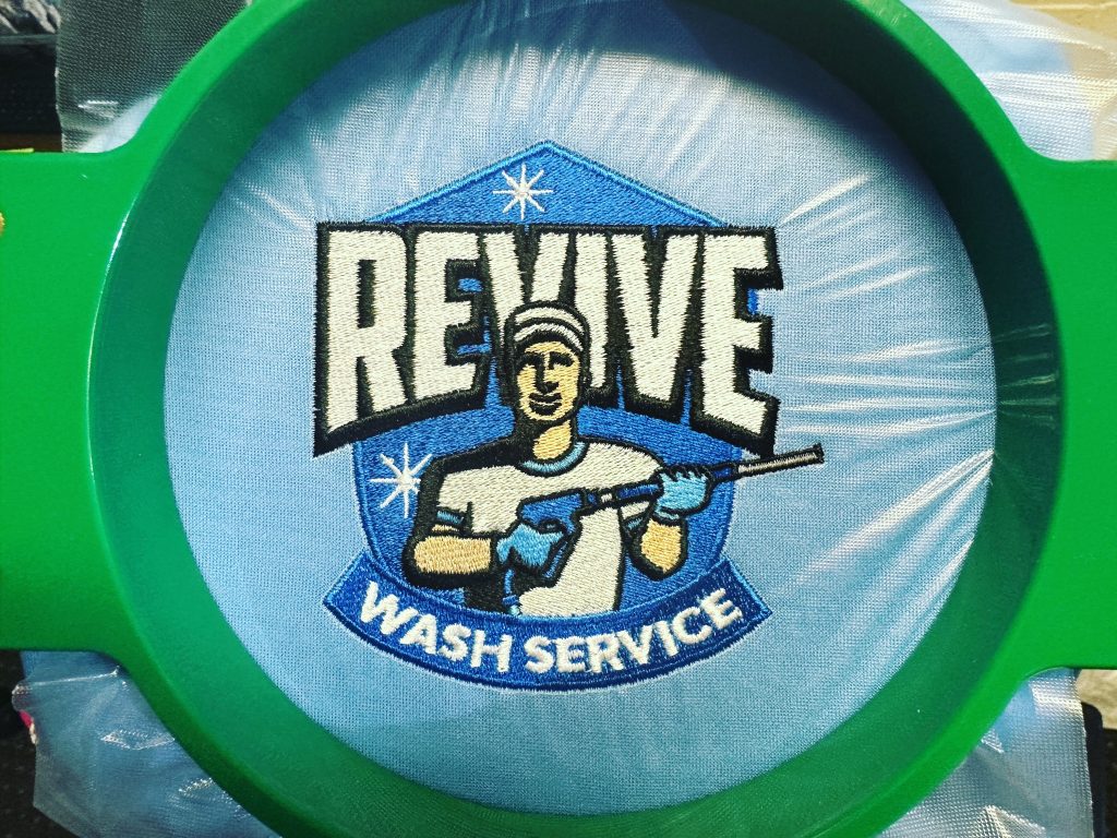 Custom full color logo embroidery for a local service company