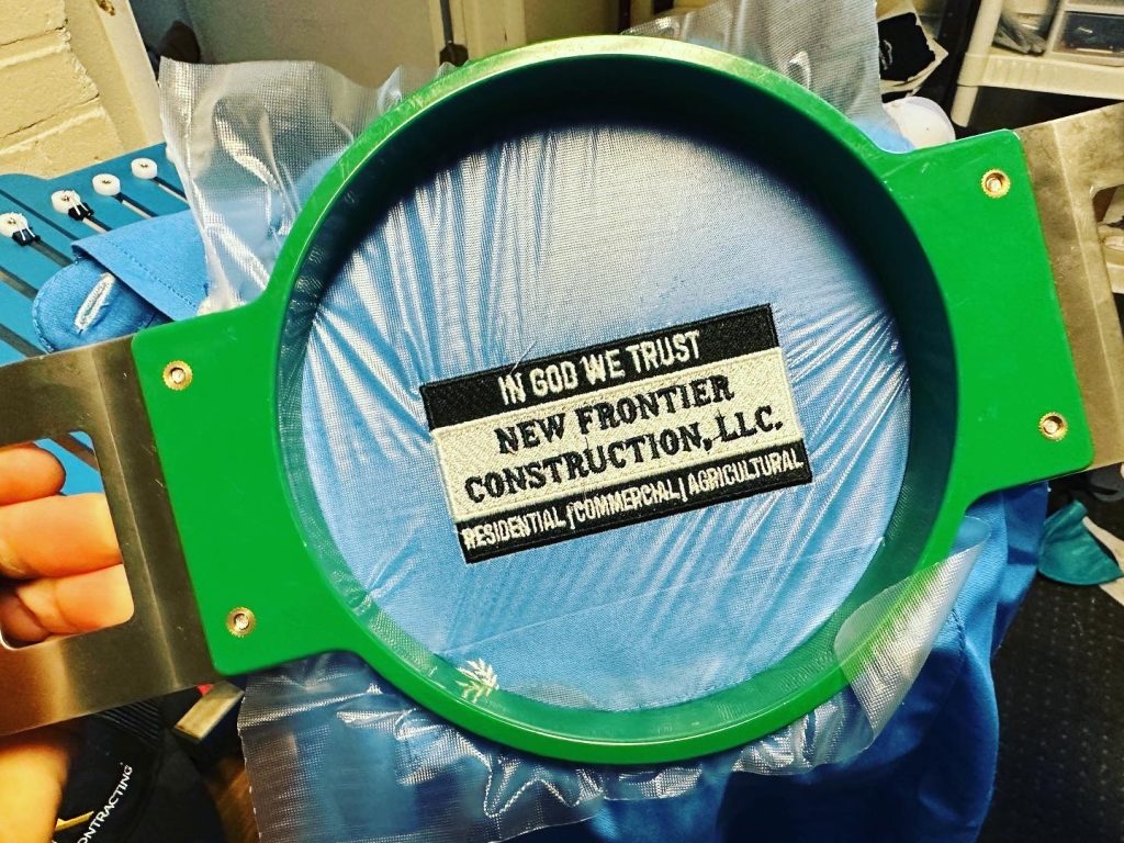 Custom embroidered polo on the hoop for production at The Print Plug
