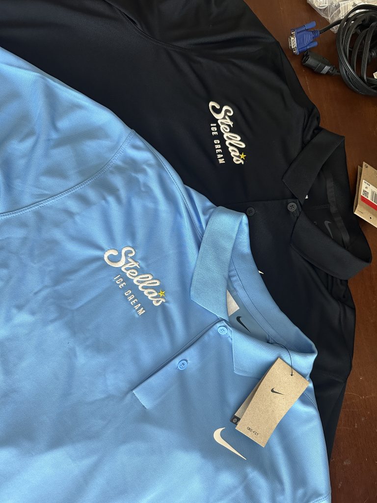 A pair of custom embroidered polos for a local ice cream shop
