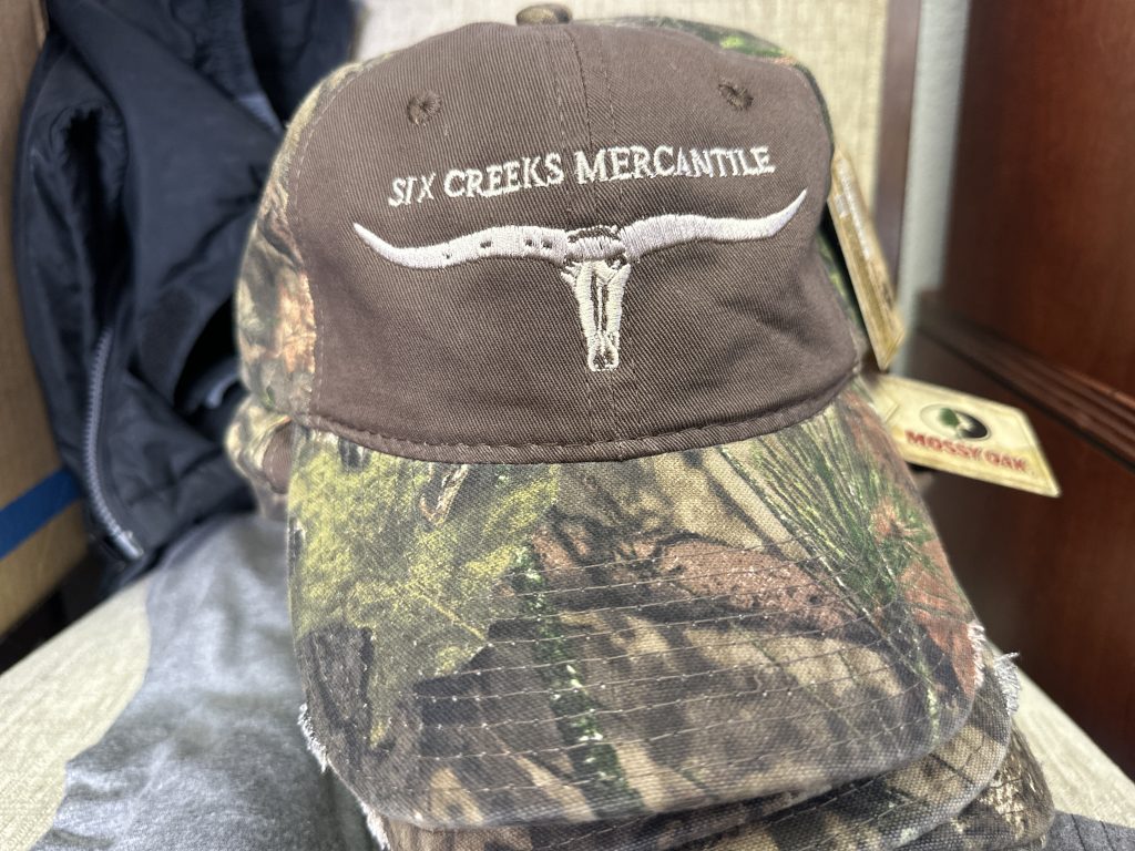 Ram head logo embroidered onto a camouflage hunter's hat