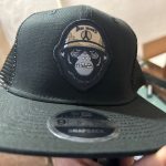 Custom embroidered patch on a snapback baseball hat in Nampa